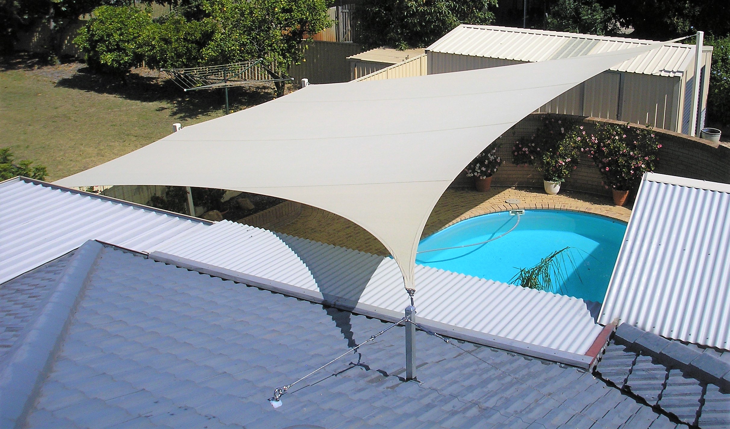Desert Sand Sail was designed to provide both shade and privacy for people using the pool.